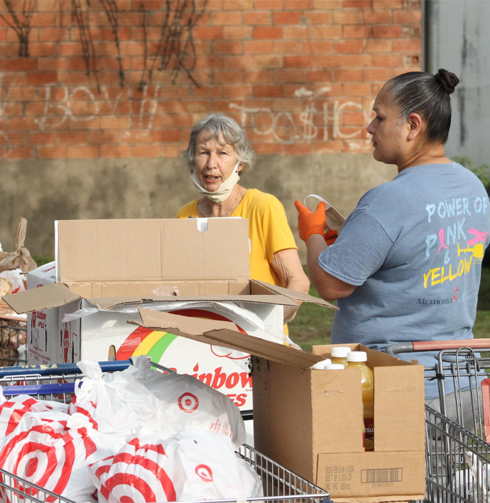 Volunteers from the church and community working together to sort donated food items for the CAMAL House in Cuero, Texas