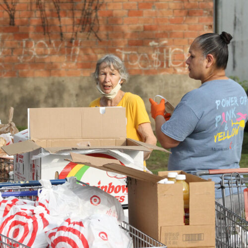 Volunteers from the church and community working together to sort donated food items for the CAMAL House in Cuero, Texas